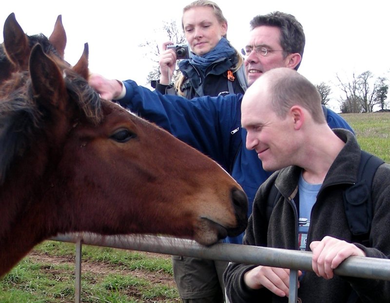 Nadine Matthias, Tim Porter and Mark Hicken making friends with an equestrian.